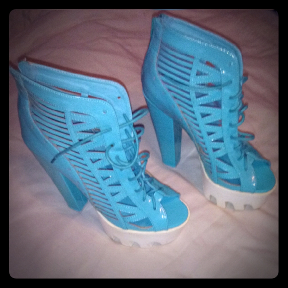 heels. Zips up the back tie in front